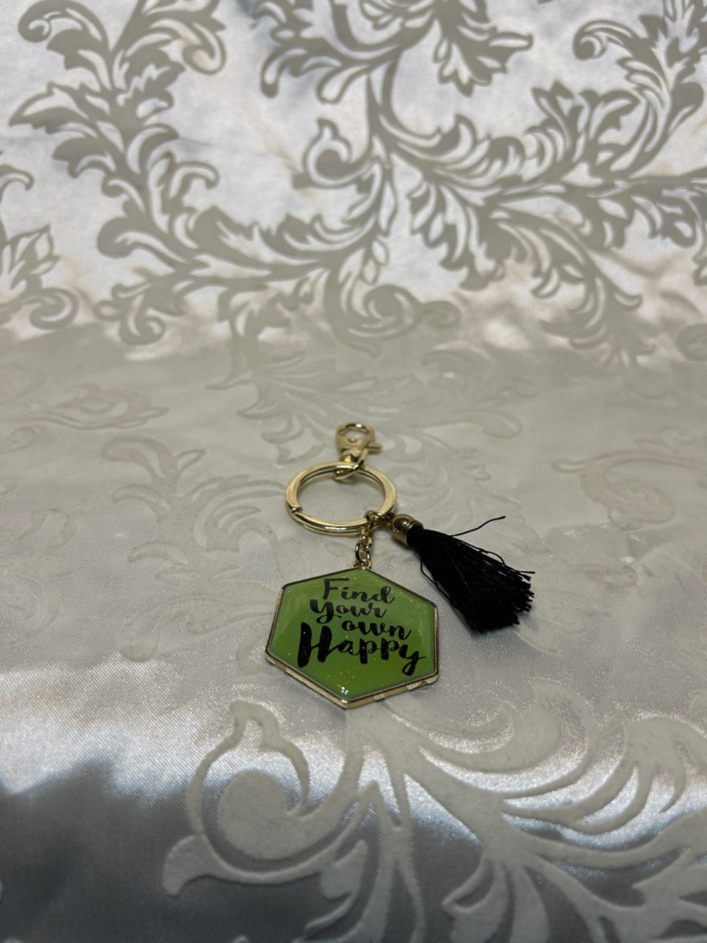 GANZ Gold Keychain with Green Inspirational Charm and Black Tassel Accent